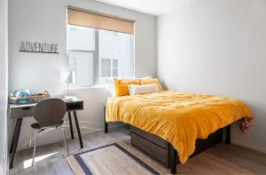 Cozy bedroom with yellow bedding.