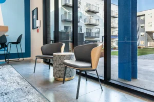 Modern chairs by large glass windows
